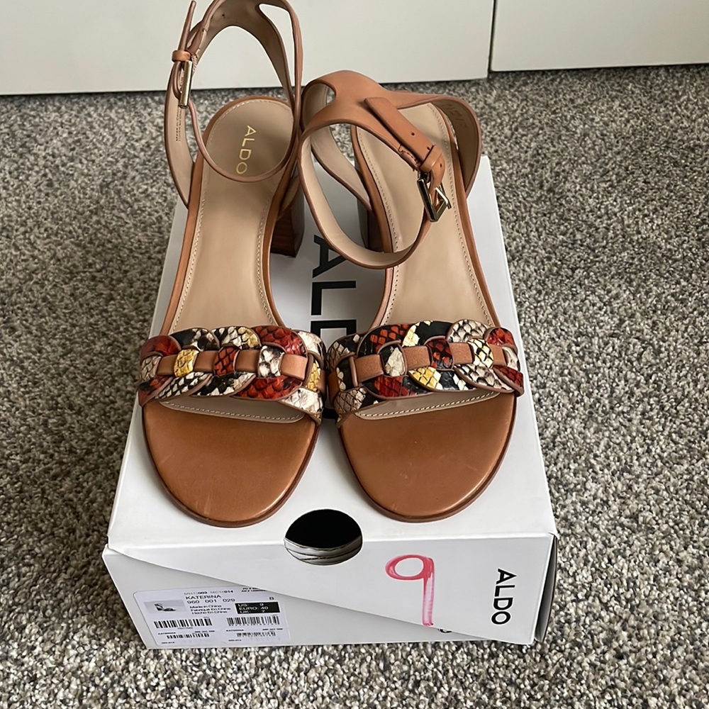 Multi colored snake skin and brown sandals with ankle strap